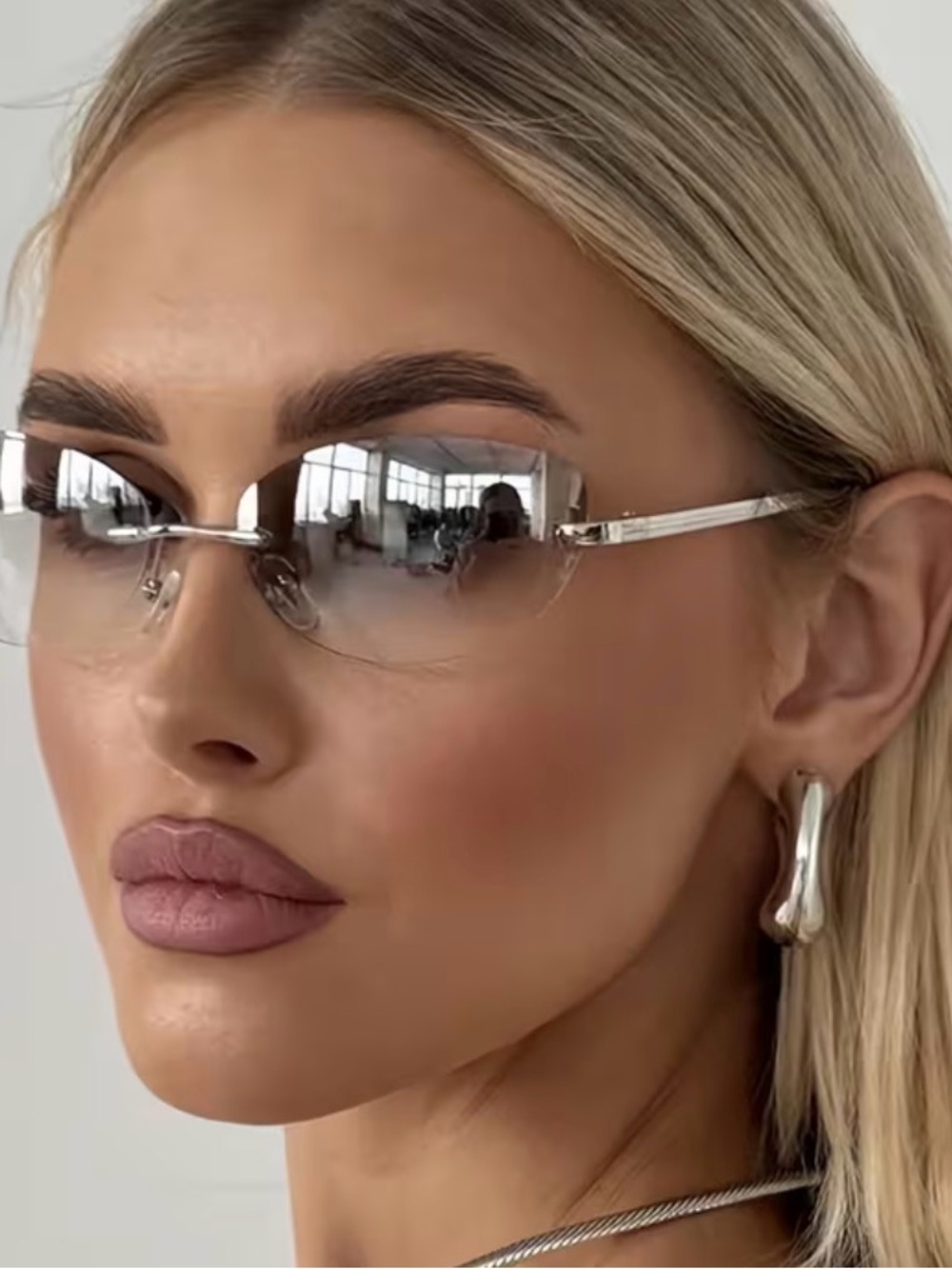 Silvery Rimless Sunglasses for Women - Modern Minimalist Style